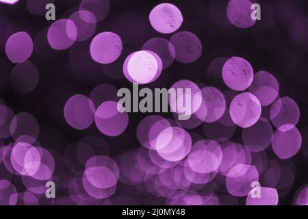Abstract purple defocused circular light backdrop Stock Photo