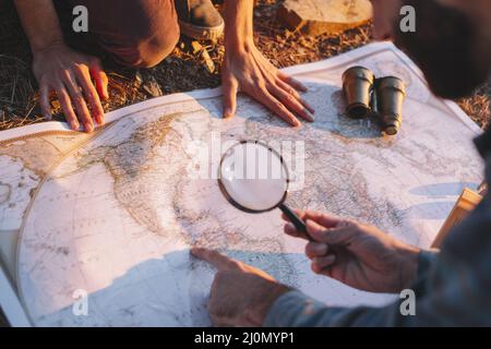Crop man exploring map Stock Photo