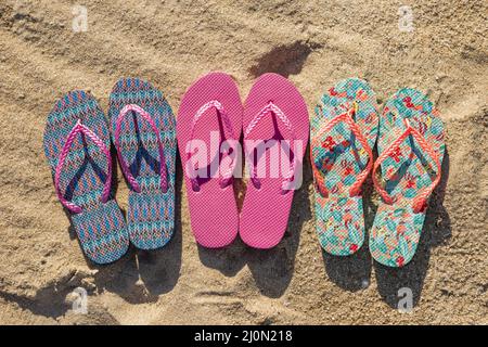 Flat lay three pairs flip flops Stock Photo