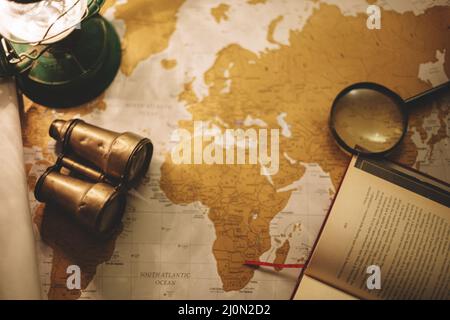 Binoculars magnifying glass map Stock Photo