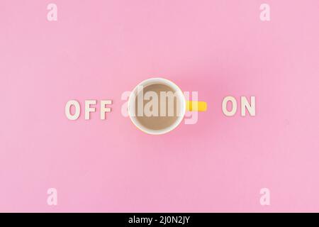 Coffee cup near off writings Stock Photo