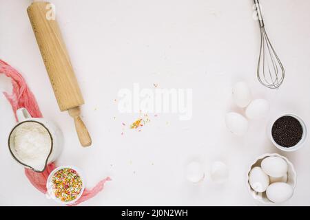 Cooking ingredients near whisk rolling pin Stock Photo