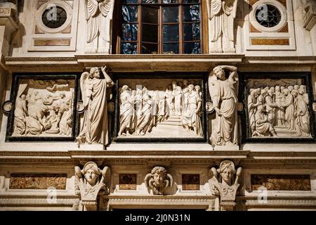 Statues on the decorative design of the organ in the Duomo. Milan, Italy Stock Photo