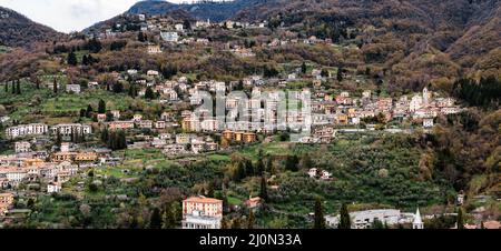 Colorful houses of the town of Varenna surrounded by mountains on the shores of Lake Como. Italy Stock Photo