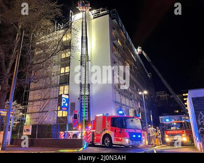 Duesseldorf, Germany. 19th Mar, 2022. Fire engines parked in front of St. Vincent Hospital. A ward has been evacuated in a fire at Düsseldorf's St. Vincent Hospital. Nine patients were moved to other floors on Saturday evening, a spokesman for the fire department said on Sunday. (to dpa: 'Fire in Düsseldorf hospital - ward evacuated') Credit: Alexander Forstreuter/dpa/Alamy Live News Stock Photo