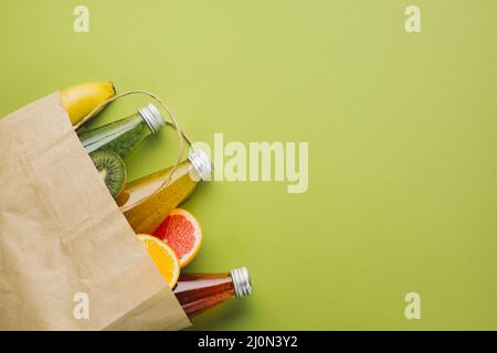 Flatlay paper bag with fruit juices Stock Photo