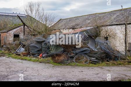 Pile of rusty metal fences piled up as agricultural farm waste Stock Photo