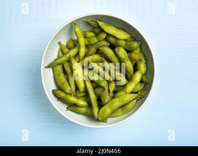 Flat lay edamame beans in bowl Stock Photo