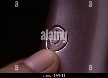 Close-up of the power button of an electronic device Stock Photo