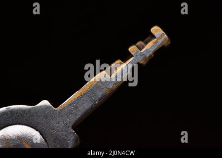 The old rusty key isolated Stock Photo
