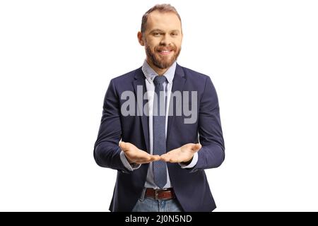 Young professional man holding something imaginary in his hands and smiling isolated on white background Stock Photo
