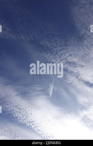 Thin veil clouds in the blue sky Stock Photo