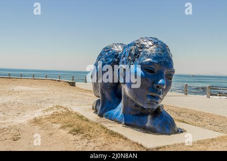 Blue heads statue in Cape Town. Art of south Africa.