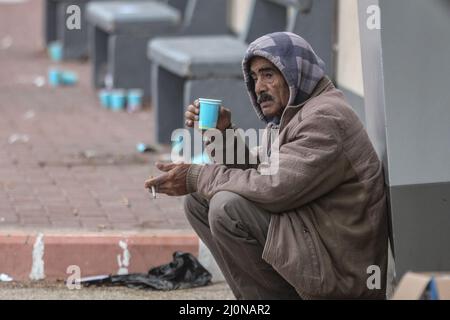 Beit Hanoun, Palestinian Territories. 20th Mar, 2022. A man waits outside the Erez crossing as Palestinian workers leave Beit Hanoun in the northern Gaza Strip, to go to work inside Israel. Israel prepares to issue 2,000 work permits to Palestinians living in Gaza, raising the total number of workers on the Israeli side to 12,000. Credit: Mohammed Talatene/dpa/Alamy Live News Stock Photo