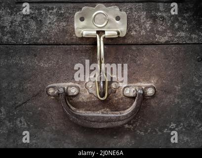 The metallic lockable closure of a suitcase or a chest. Stock Photo