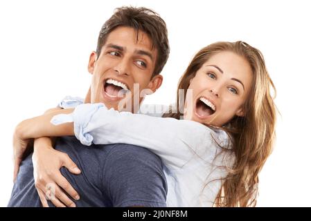 Love makes the world go round. A young couple having fun together. Stock Photo