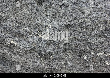 Full frame view of black lava pumice rock. Stock Photo
