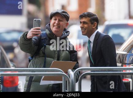 London, UK. 20th Mar, 2022. Rishi Sunak poses for a photograph with an autograph hunter. Chancellor of the Exchequer, Rishi Sunak, at the BBC for ÔSunday MorningÕ with Sophie Raworth. Credit: Mark Thomas/Alamy Live News Stock Photo