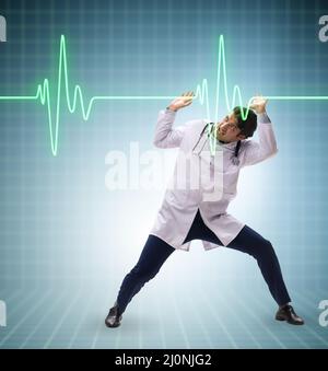 Doctor cardiologist supporting cardiogram heart line Stock Photo