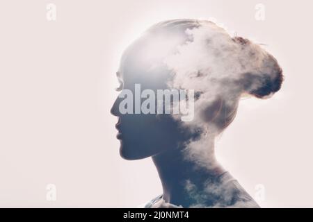 Psychology concept. Sunrise and woman silhouette head Stock Photo