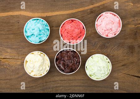 Cups with ice-cream of different tastes. Stock Photo