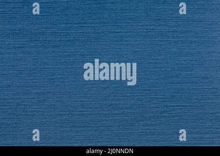Simply dark deep blue paper texture on macro. Stock Photo