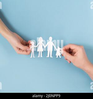 Top view people holding hands cute paper family. High quality and resolution beautiful photo concept Stock Photo
