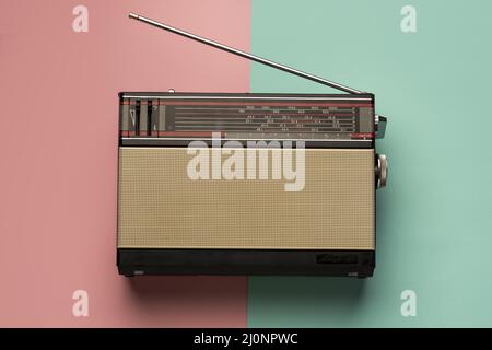 Retro broadcast radio receiver pink light blue background . High quality and resolution beautiful photo concept Stock Photo