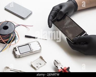 Man holding phone with broken display . High quality and resolution beautiful photo concept Stock Photo