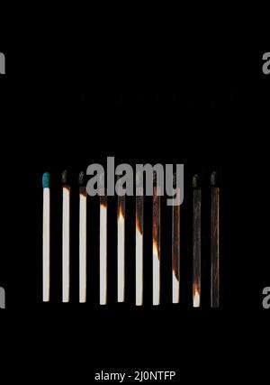 Burning match stick in white background Stock Photo - Alamy