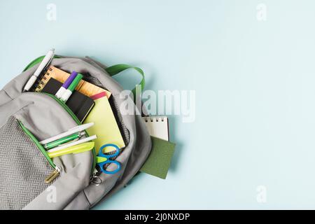 Opened backpack with school supplies . High quality and resolution beautiful photo concept Stock Photo