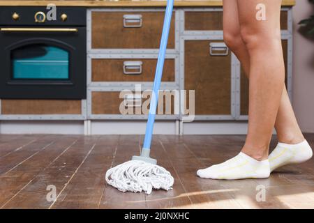 Low section cleaner mopping floor kitchen . High quality and resolution beautiful photo concept Stock Photo