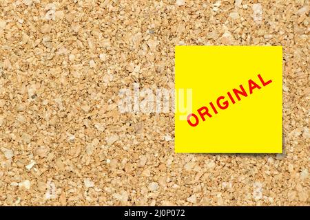 Yellow note paper with word original on cork board background with copy space Stock Photo