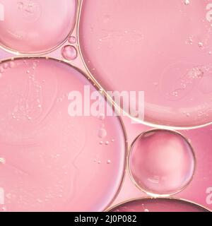 Translucent oil drops liquid smooth rose blurred background. High quality and resolution beautiful photo concept Stock Photo