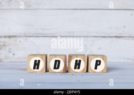 HDHP concept written on wooden cubes or blocks, on white wooden background. Stock Photo