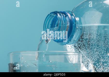 Pouring sparkling water in cup . High quality and resolution beautiful photo concept Stock Photo