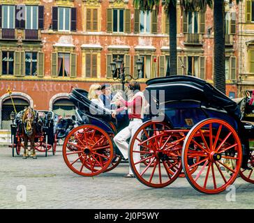 Vintage Rome 1970s, couple chatting with barouche driver, Piazza di Spagna square, Italy, Europe, Stock Photo