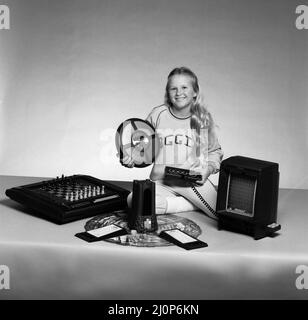 A young girl with a selection of children's toys. 11th November 1983. Stock Photo