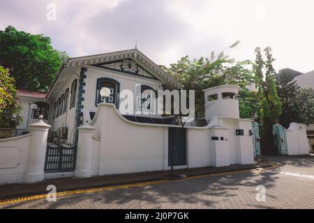 White Gates and Building of the Old Friday Mosque or the Malé Hukuru Miskiy  in the city of Male, Kaafu Atoll Stock Photo