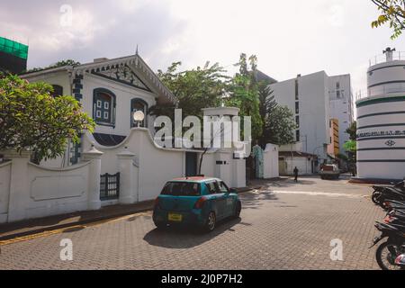 White Gates and Building of the Old Friday Mosque or the Malé Hukuru Miskiy  in the city of Male, Kaafu Atoll Stock Photo