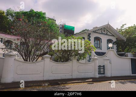 White Gates and Building of the Old Friday Mosque or the Malé Hukuru Miskiy  in the city of Male, Kaafu Atoll Stock Photo