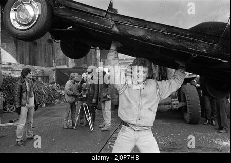 UB40 filming a video film in a scrapyard. The video film will feature songs from their album 'Labour of Love'. Pictured, Brian Travers, saxophonist with the band and producer of the video. 21st January 1983. Stock Photo