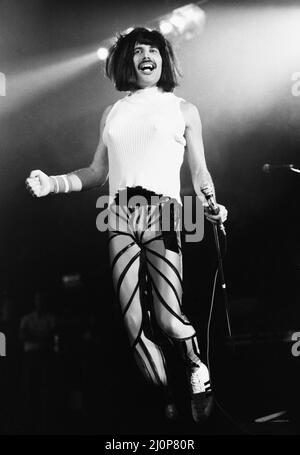 Rock group Queen in concert at Wembley Arena.Lead singer Freddie Mercury performing on stage on his 38th birthday in drag. 5th September 1984. Stock Photo