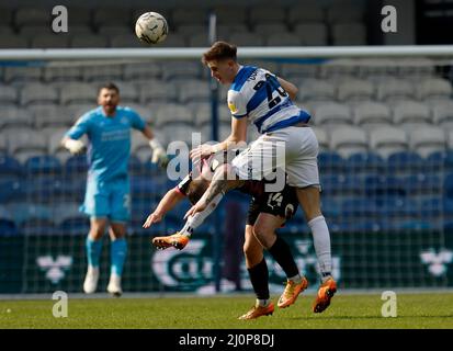 Queens Park Rangers' Jimmy Dunne battles with Peterborough United's Kwame Poku during the Sky Bet Championship match at the Kiyan Prince Foundation Stadium, London. Picture date: Sunday March 20, 2022. Stock Photo