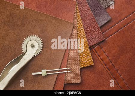 Top view leather with needle. High quality and resolution beautiful photo concept Stock Photo