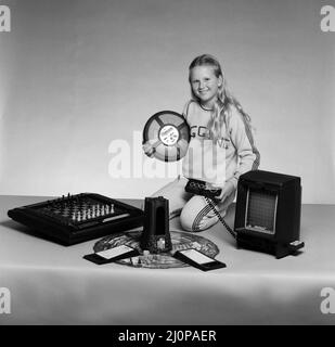 A young girl with a selection of children's toys. 11th November 1983. Stock Photo