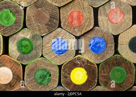 End view of wooden colored pencils. Colorful Pencils End. Macro. Close up. Abstract. Background. Texture. Stock Photo