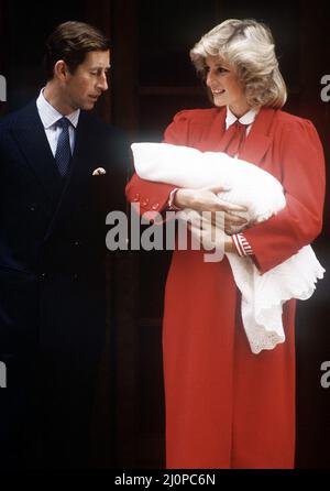 Princess Diana and Prince Charles leaving St Mary's Hospital, London with their newborn son, Prince Harry, 16th September 1984.  The Princess is wearing a red coat by Jan van Velden. Stock Photo