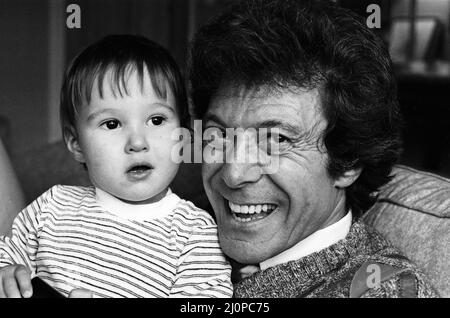 Lionel Blair pictured at home with his son. 19th October 1983. Stock Photo