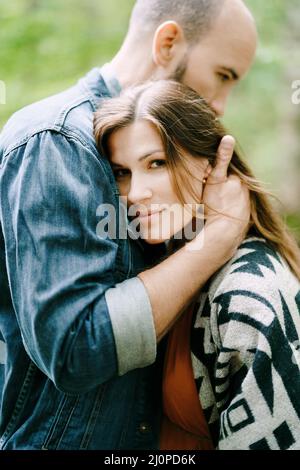 man and a woman hug in the park against sun in summer Stock Photo - Alamy